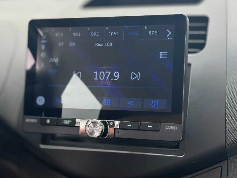 Modern touchscreen head unit installed in a car dash in Malden, MA