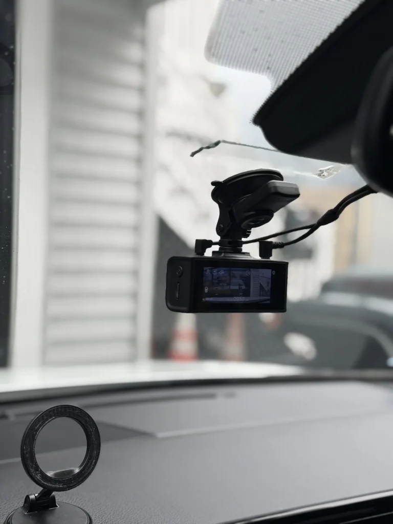 Front dash cam installed on the windshield above the dashboard