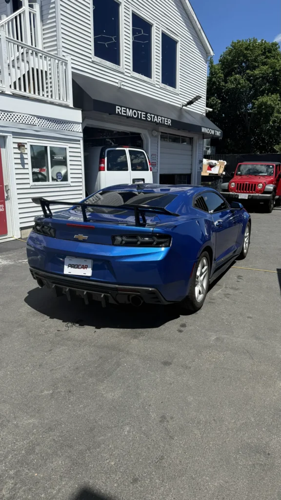 Blue Chevrolet Camaro with tinted rear window