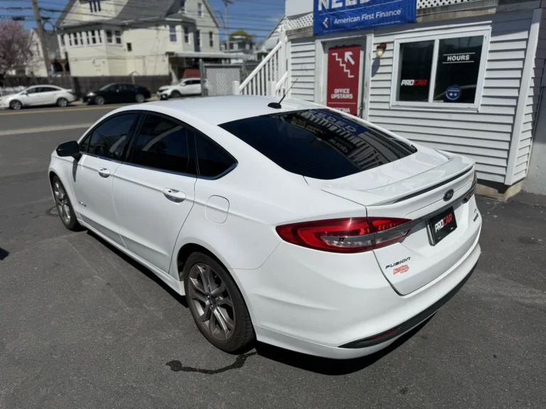 White Ford Fusion with tinted windows parked at Pro Car in Malden